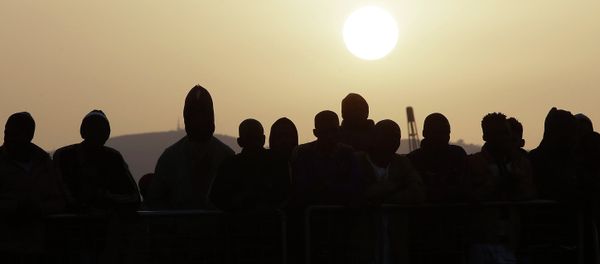 Migrants wait to disembark from the Iceland Coast Guard vessel Tyr, at the Messina harbor, Sicily, southern Italy - Sputnik International