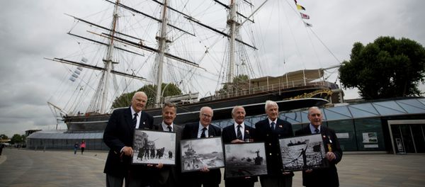 Veterans who served in Britain's Merchant Navy pose with a selection of Royal Mail Merchant Navy stamps during a launch at the Cutty Sark clipper vessel in London, Wednesday, Sept. 18, 2013 - Sputnik International