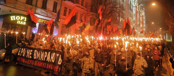 Ukrainian nationalists carry torches and a banner reading 'Heroes do not die' during a rally in downtown Kiev, Ukraine, late Thursday, Jan. 1, 2015 Ukrainian nationalists carry torches and a banner reading 'Heroes do not die' during a rally in downtown Kiev, Ukraine, late Thursday, Jan. 1, 2015 - Sputnik International