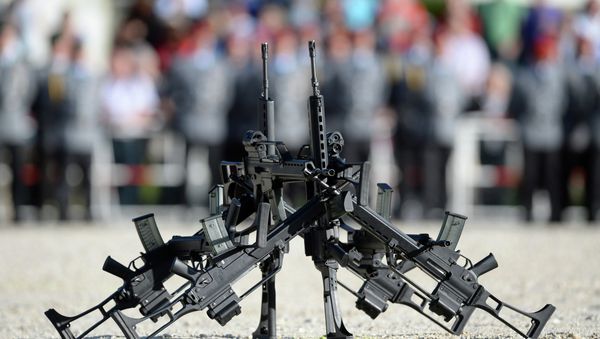 FILE - In this June 5, 2014 file photo G36 rifles of manufacturer Heckler&Koch stand in front of soldiers in Sigmaringen, southern Germany - Sputnik International