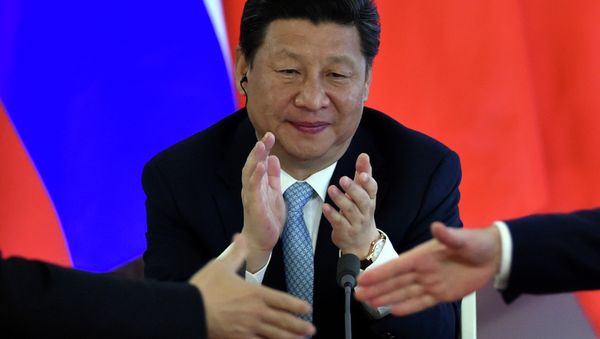 Chinese President Xi Jinping applauds during a signing ceremony after a meeting with his Russian counterpart at the Kremlin in Moscow on May 8, 2015 Chinese President Xi Jinping applauds during a signing ceremony after a meeting with his Russian counterpart at the Kremlin in Moscow on May 8, 2015 - Sputnik International
