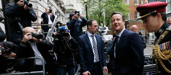 Britain's Prime Minister David Cameron, left, leaves 10 Downing Street in London with a soldier, to attend a VE Day service at the Cenotaph, Friday, May 8, 2015 Britain's Prime Minister David Cameron, left, leaves 10 Downing Street in London with a soldier, to attend a VE Day service at the Cenotaph, Friday, May 8, 2015 - Sputnik International