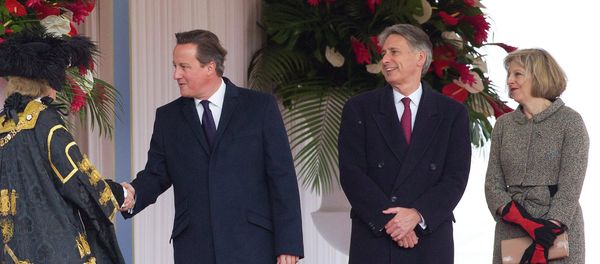 British Prime Minister David Cameron (2L), Foreign Secretary Philip Hammond (C) and Home Secretary Theresa May (R) - Sputnik International