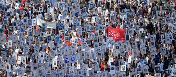 Participants of procession of Regional patriotic public organization Immortal Regiment Moscow along the Red Square Participants of procession of Regional patriotic public organization Immortal Regiment Moscow along the Red Square - Sputnik International