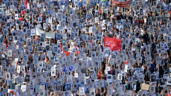 Participants of procession of Regional patriotic public organization Immortal Regiment Moscow along the Red Square Participants of procession of Regional patriotic public organization Immortal Regiment Moscow along the Red Square - Sputnik International