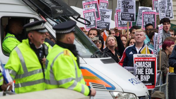 Demonstrators opposed to the far-right English Defence League (EDL) stage a counter-demonstration during a march by trhe EDL in London on September 20, 2014. File Photo Demonstrators opposed to the far-right English Defence League (EDL) stage a counter-demonstration during a march by trhe EDL in London on September 20, 2014. File Photo - Sputnik International