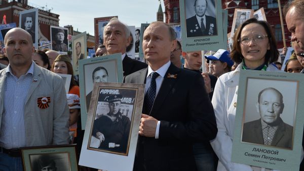 Russian President Vladimir Putin participates in march of Immortal Regiment in downtown Moscow Russian President Vladimir Putin participates in march of Immortal Regiment in downtown Moscow - Sputnik International