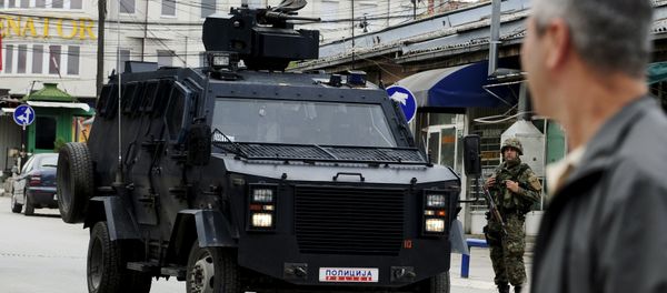A Macedonian police armoured personnel carrier drives past premises in Kumanovo, north of the capital Skopje, Macedonia May 9, 2015 A Macedonian police armoured personnel carrier drives past premises in Kumanovo, north of the capital Skopje, Macedonia May 9, 2015 - Sputnik International