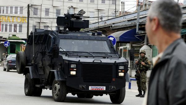 A Macedonian police armoured personnel carrier drives past premises in Kumanovo, north of the capital Skopje, Macedonia May 9, 2015 A Macedonian police armoured personnel carrier drives past premises in Kumanovo, north of the capital Skopje, Macedonia May 9, 2015 - Sputnik International