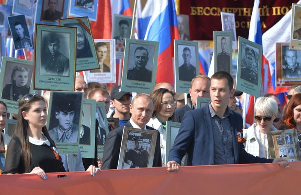 Russian President Vladimir Putin participates in march of Immortal Regiment in downtown Moscow Russian President Vladimir Putin participates in march of Immortal Regiment in downtown Moscow - Sputnik International