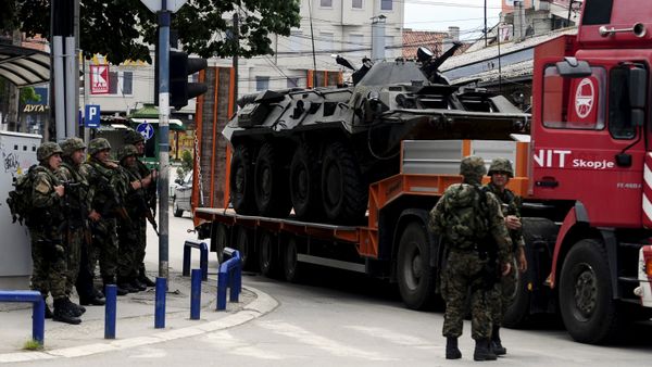 A truck loaded with a damaged armored police vehicle passes near police check point in Kumanovo, Macedonia A truck loaded with a damaged armored police vehicle passes near police check point in Kumanovo, Macedonia - Sputnik International