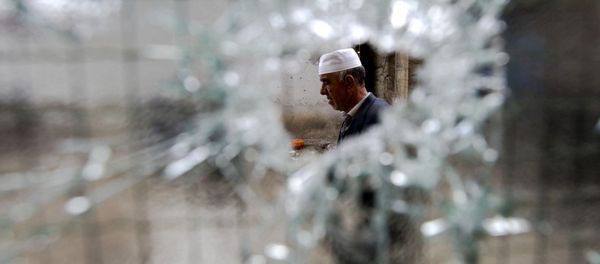 A resident visits the neighborhood where a battle took place over the weekend involving the police and an armed group, in northern Macedonian town of Kumanovo. A resident visits the neighborhood where a battle took place over the weekend involving the police and an armed group, in northern Macedonian town of Kumanovo. - Sputnik International