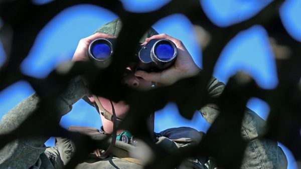 Russian soldier looking through binoculars during military exercise in the Kaliningrad Region. File photo. Russian soldier looking through binoculars during military exercise in the Kaliningrad Region. File photo. - Sputnik International