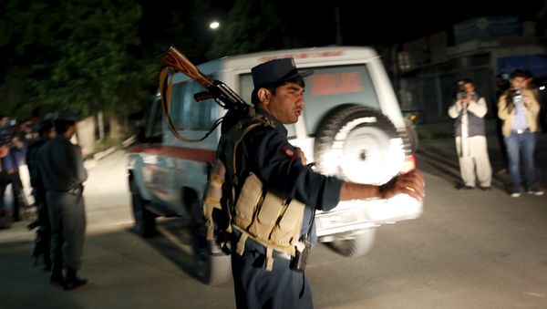 Afghan policeman stands guard at the site of an attack in Kabul, Afghanistan May 14, 2015 Afghan policeman stands guard at the site of an attack in Kabul, Afghanistan May 14, 2015 - Sputnik International