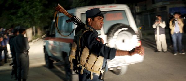 Afghan policeman stands guard at the site of an attack in Kabul, Afghanistan May 14, 2015 Afghan policeman stands guard at the site of an attack in Kabul, Afghanistan May 14, 2015 - Sputnik International