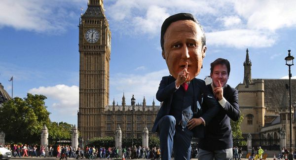 Free speech campaigners, one wearing a mask depicting British Prime Minister David Cameron, left, and another wearing a mask depicting ex-LibDem leader Nick Clegg, stage a photo op for the media during a protest opposite from the Houses of Parliament in central London in 2013. Free speech campaigners, one wearing a mask depicting British Prime Minister David Cameron, left, and another wearing a mask depicting ex-LibDem leader Nick Clegg, stage a photo op for the media during a protest opposite from the Houses of Parliament in central London in 2013. - Sputnik International