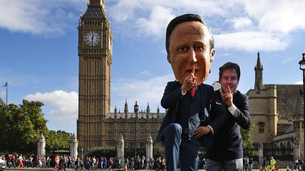 Free speech campaigners, one wearing a mask depicting British Prime Minister David Cameron, left, and another wearing a mask depicting ex-LibDem leader Nick Clegg, stage a photo op for the media during a protest opposite from the Houses of Parliament in central London in 2013.  - Sputnik International