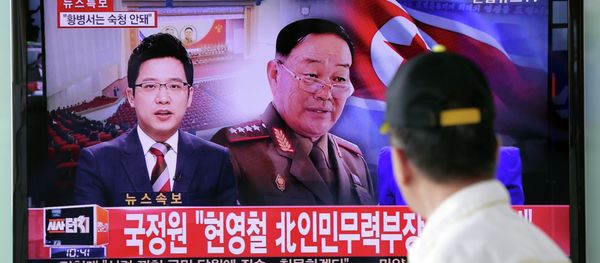 A man watches a TV news program reporting that North Korean People's Armed Forces Minister Hyon Yong Chol was killed by anti-aircraft gunfire A man watches a TV news program reporting that North Korean People's Armed Forces Minister Hyon Yong Chol was killed by anti-aircraft gunfire - Sputnik International