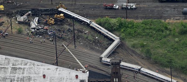 Emergency personnel work at the scene of a deadly train derailment, Wednesday, May 13, 2015, in Philadelphia Emergency personnel work at the scene of a deadly train derailment, Wednesday, May 13, 2015, in Philadelphia - Sputnik International