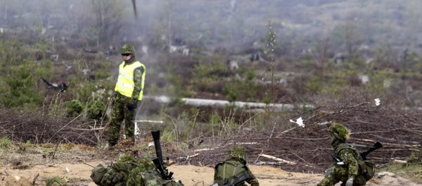 Estonian army soldiers launch grenade during the NATO military exercise Hedgehog 2015 at the Tapa training range in Estonia May 12, 2015 Estonian army soldiers launch grenade during the NATO military exercise Hedgehog 2015 at the Tapa training range in Estonia May 12, 2015 - Sputnik International