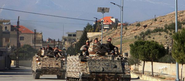 Lebanese army troops drive armoured personnel carriers (APC) in the village of Ras Baalbak in the eastern Bekaa Valley near the border with Syria during clashes between Islamist fighters and Lebanese troops on Jananuary 23, 2015 Lebanese army troops drive armoured personnel carriers (APC) in the village of Ras Baalbak in the eastern Bekaa Valley near the border with Syria during clashes between Islamist fighters and Lebanese troops on Jananuary 23, 2015 - Sputnik International