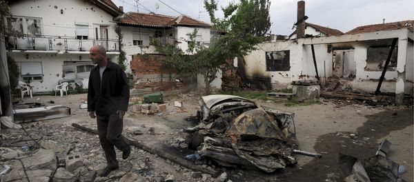 A man walks through a damaged house in Kumanovo, Macedonia May 11, 2015 A man walks through a damaged house in Kumanovo, Macedonia May 11, 2015 - Sputnik International
