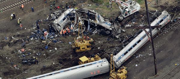 Emergency personnel work at the scene of a deadly train derailment, Wednesday, May 13, 2015, in Philadelphia Emergency personnel work at the scene of a deadly train derailment, Wednesday, May 13, 2015, in Philadelphia - Sputnik International