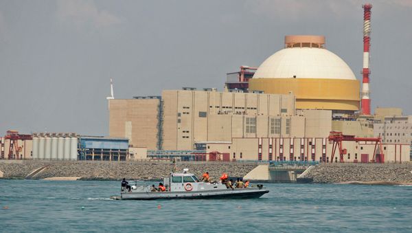 Indian coast guards ride on a boat near the Russian-built Kudankulam Atomic Power Project, background, during a protest at Kudankulam, about 700 kilometers (440 miles) south of Chennai, Tamil Nadu state, India - Sputnik International
