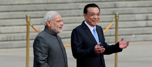 India's Prime Minister Narendra Modi, left, chats with Chinese Premier Li Keqiang during a welcome ceremony outside the Great Hall of the People in Beijing, China, Friday, May 15, 2015. India's Prime Minister Narendra Modi, left, chats with Chinese Premier Li Keqiang during a welcome ceremony outside the Great Hall of the People in Beijing, China, Friday, May 15, 2015. - Sputnik International