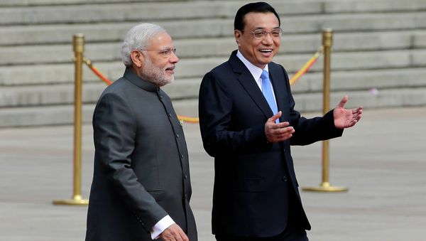India's Prime Minister Narendra Modi, left, chats with Chinese Premier Li Keqiang during a welcome ceremony outside the Great Hall of the People in Beijing, China, Friday, May 15, 2015. India's Prime Minister Narendra Modi, left, chats with Chinese Premier Li Keqiang during a welcome ceremony outside the Great Hall of the People in Beijing, China, Friday, May 15, 2015. - Sputnik International