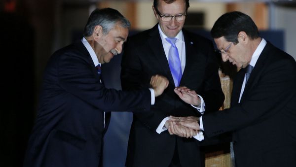 Cyprus' president Nicos Anastasiades, right, Turkish Cypriot leader Mustafa Akinci, left, and United Nations envoy Espen Barth Eide shake hands. Cyprus' president Nicos Anastasiades, right, Turkish Cypriot leader Mustafa Akinci, left, and United Nations envoy Espen Barth Eide shake hands. - Sputnik International