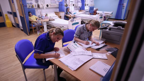 Members of clinical staff complete paperwork in the Accident and Emergency department of the 'Royal Albert Edward Infirmary' in Wigan, north west England on April 2, 2015 Members of clinical staff complete paperwork in the Accident and Emergency department of the 'Royal Albert Edward Infirmary' in Wigan, north west England on April 2, 2015 - Sputnik International