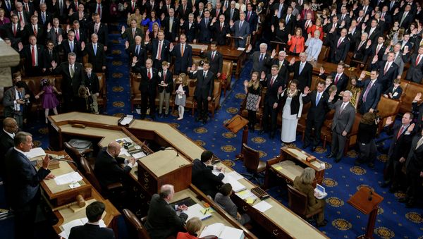 Speaker of the House John Boehner(L),R-OH, swears in members of the House during a ceremony in the House of Representatives as the 114th Congress convenes on Capitol Hill January 6, 2015 in Washington - Sputnik International