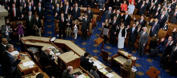 Speaker of the House John Boehner(L),R-OH, swears in members of the House during a ceremony in the House of Representatives as the 114th Congress convenes on Capitol Hill January 6, 2015 in Washington - Sputnik International