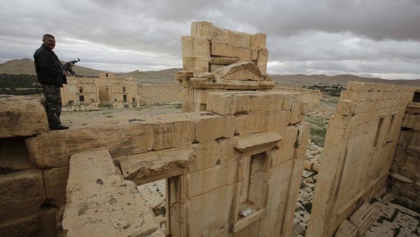 A file picture taken on March 14, 2014 shows a Syrian policeman standing on the sanctury of Baal in the ancient oasis city of Palmyra, 215 kilometres northeast of Damascus A file picture taken on March 14, 2014 shows a Syrian policeman standing on the sanctury of Baal in the ancient oasis city of Palmyra, 215 kilometres northeast of Damascus - Sputnik International