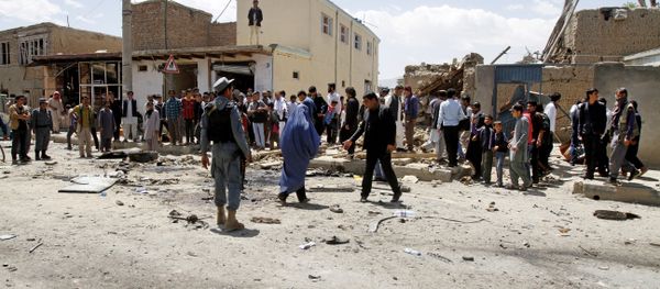 Afghan security forces inspect the site of suicide attack near an international airport in Kabul, Afghanistan, Sunday, May 17, 2015 Afghan security forces inspect the site of suicide attack near an international airport in Kabul, Afghanistan, Sunday, May 17, 2015 - Sputnik International