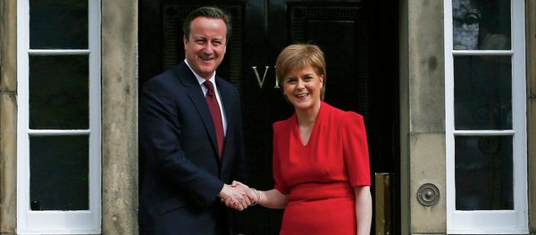 Scotland's First Minister Nicola Sturgeon (R), greets Britain's Prime Minister David Cameron, as he arrives for their meeting in Edinburgh, Scotland, Britain May 15, 2015 Scotland's First Minister Nicola Sturgeon (R), greets Britain's Prime Minister David Cameron, as he arrives for their meeting in Edinburgh, Scotland, Britain May 15, 2015 - Sputnik International