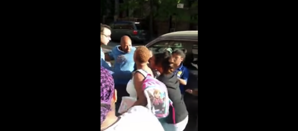 Screenshot of cell phone footage in which police attempt to arrest a 14-year-old girl - Sputnik International