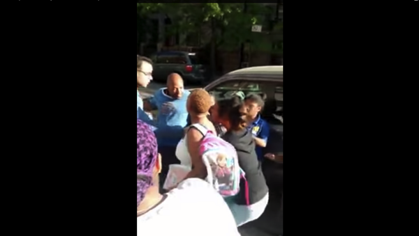 Screenshot of cell phone footage in which police attempt to arrest a 14-year-old girl Screenshot of cell phone footage in which police attempt to arrest a 14-year-old girl - Sputnik International