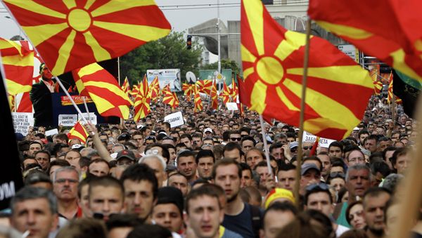 People wave national flags during a protest in front of the Government building in Skopje, Macedonia. People wave national flags during a protest in front of the Government building in Skopje, Macedonia. - Sputnik International