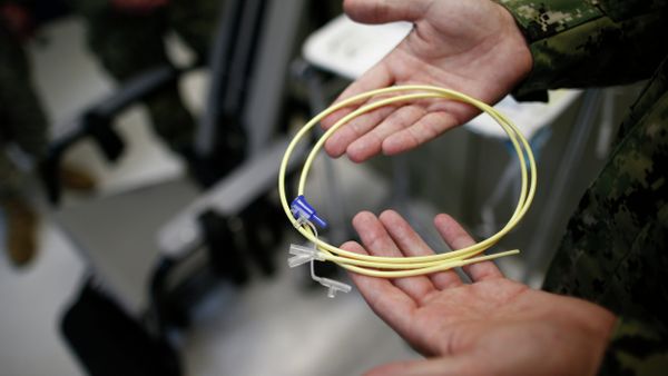 U.S. Navy medical personnel displays an internal feeding tube, used for force-feeding detainees. - Sputnik International