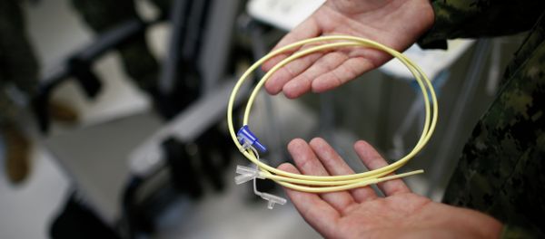 U.S. Navy medical personnel displays an internal feeding tube, used for force-feeding detainees. U.S. Navy medical personnel displays an internal feeding tube, used for force-feeding detainees. - Sputnik International