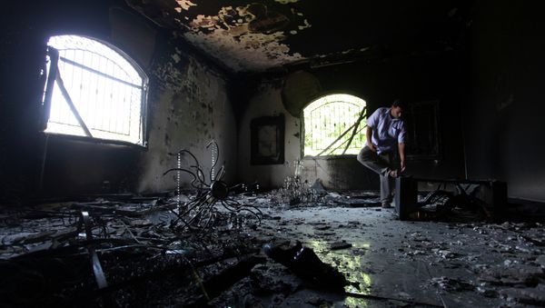 A Libyan man investigates the inside of the U.S. Consulate after an attack that killed four Americans. - Sputnik International