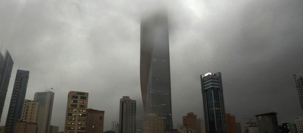 Clouds cover buildings in Kuwait City during a heavy rainfall Clouds cover buildings in Kuwait City during a heavy rainfall - Sputnik International