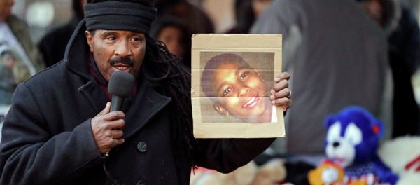 Activist Art McCoy holds a photo of Tamir Rice before a protest march at Cudell Park in Cleveland, Ohio. Activist Art McCoy holds a photo of Tamir Rice before a protest march at Cudell Park in Cleveland, Ohio. - Sputnik International