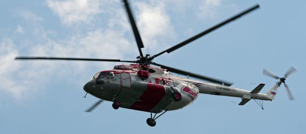 A Mi-171E (Mi-8 AMT) helicopter by Moscow's Crocus Expo exhibition hall before the HeliRussia 2015 expo. - Sputnik International