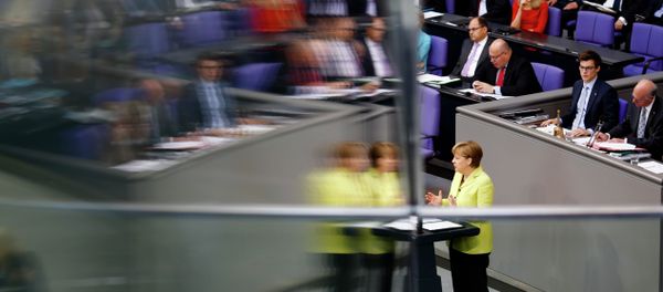 German Chancellor Angela Merkel is reflected in a window pane as she delivers a government declaration about the European Union and an Eastern Partnership with former Soviet Republics at the German parliament Bundestag in Berlin, Germany, Thursday, May 21, 2015. German Chancellor Angela Merkel is reflected in a window pane as she delivers a government declaration about the European Union and an Eastern Partnership with former Soviet Republics at the German parliament Bundestag in Berlin, Germany, Thursday, May 21, 2015. - Sputnik International