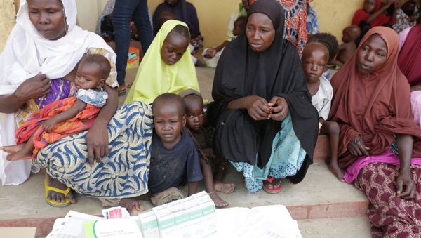 Women and children rescued by Nigerian soldiers from Boko Haram extremists at Sambisa Forest wait for treatment at a refugee camp in Yola, Nigeria. - Sputnik International