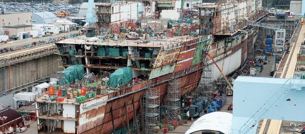 The USS Ford - seen here under construction in 2012 - ran $2 billion over budget but the Navy promised most of those costs were due to its being the first of its class and would not recur with the USS Kennedy. The USS Ford - seen here under construction in 2012 - ran $2 billion over budget but the Navy promised most of those costs were due to its being the first of its class and would not recur with the USS Kennedy. - Sputnik International