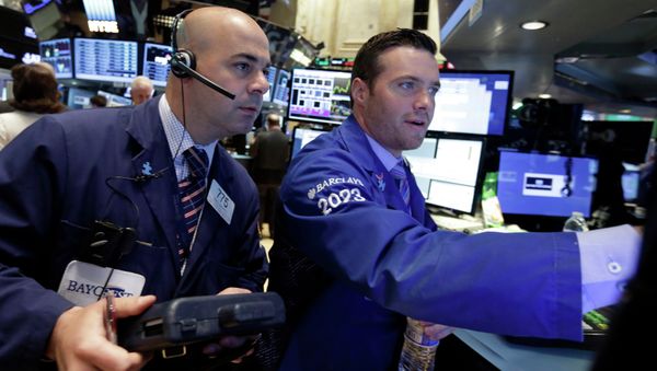 Trader Fred DeMarco, left, and specialist Frank Masiello work on the floor of the New York Stock Exchange Thursday, May 21, 2015 Trader Fred DeMarco, left, and specialist Frank Masiello work on the floor of the New York Stock Exchange Thursday, May 21, 2015 - Sputnik International